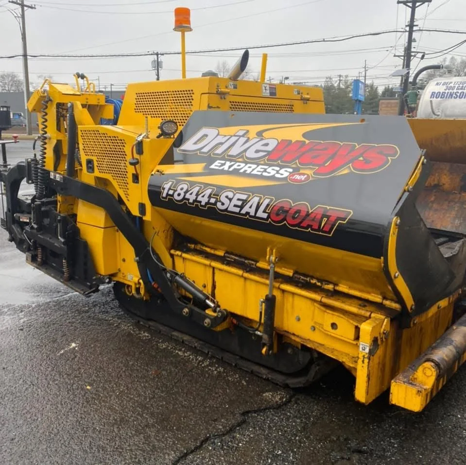 Driveways Express asphalt paver with company branding