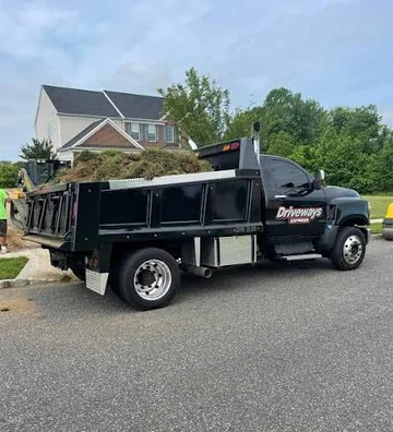 Driveways Express dump truck at a residential driveway job